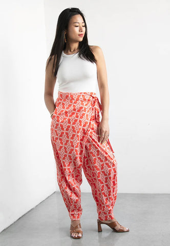 model wearing Nala Designs red wrap pants in crepe ginger flower print available at The WYLD Shop