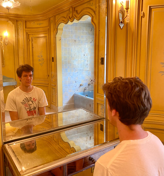 Zach Looking in Highlands Ranch Mansion Mirror