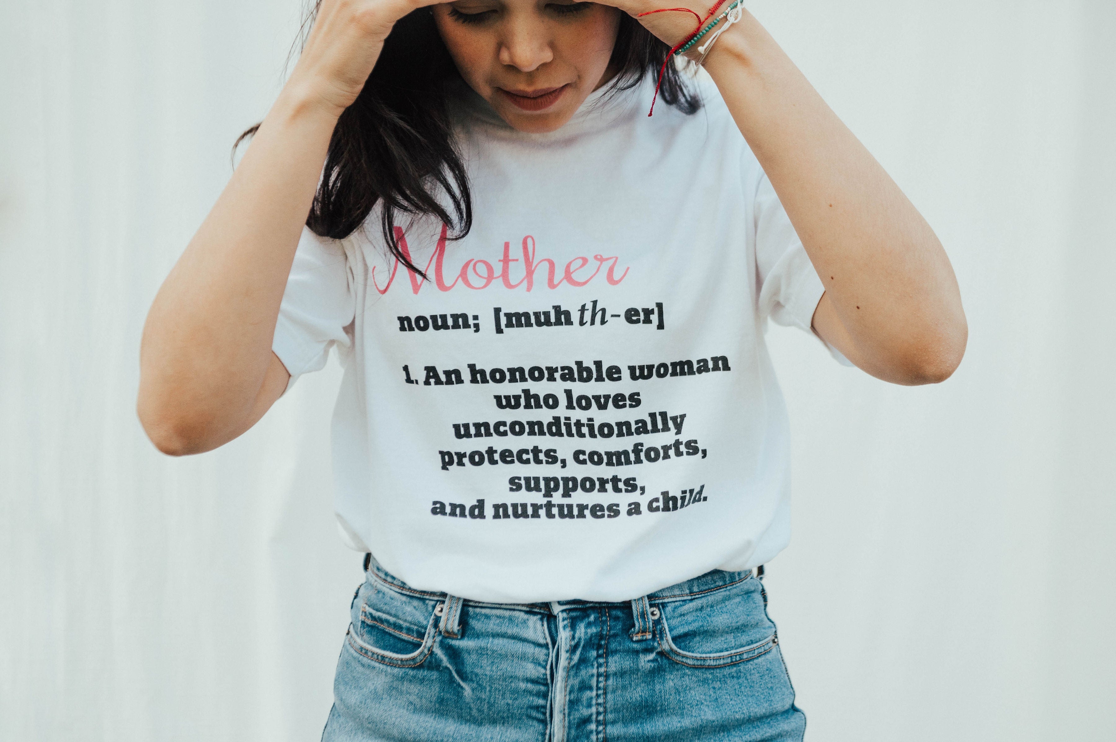 Image of a high-quality unisex Mother T-shirt made from 100% Ringspun USA cotton, featuring a ribbed crewneck collar and double-needle stitching. Designed to last, this shirt celebrates motherly love and care, perfect for honoring the remarkable women in our lives.