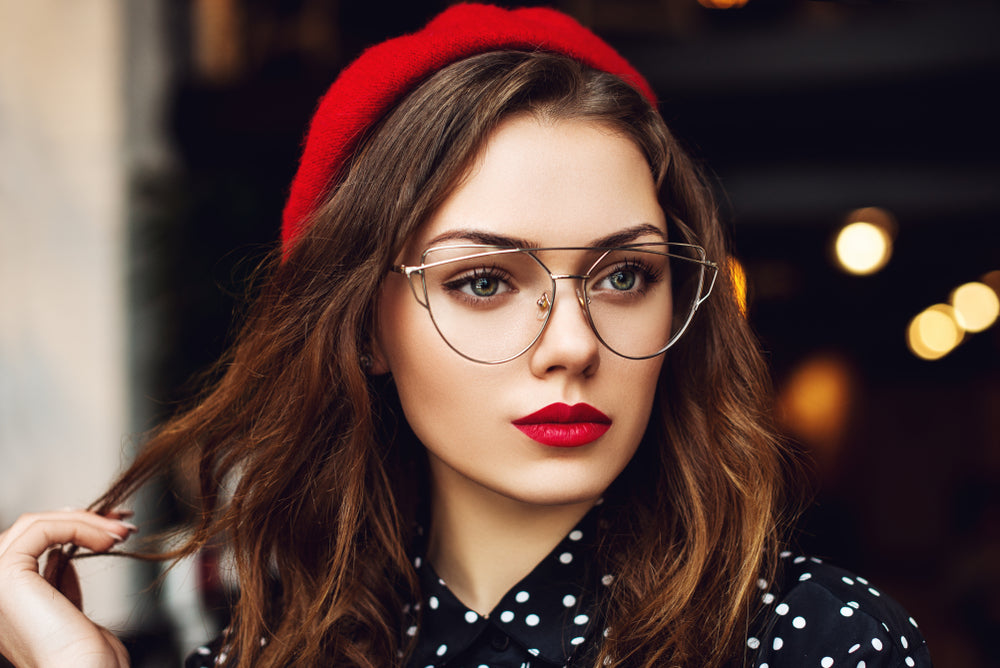 Woman in glasses wearing bright red lipstick