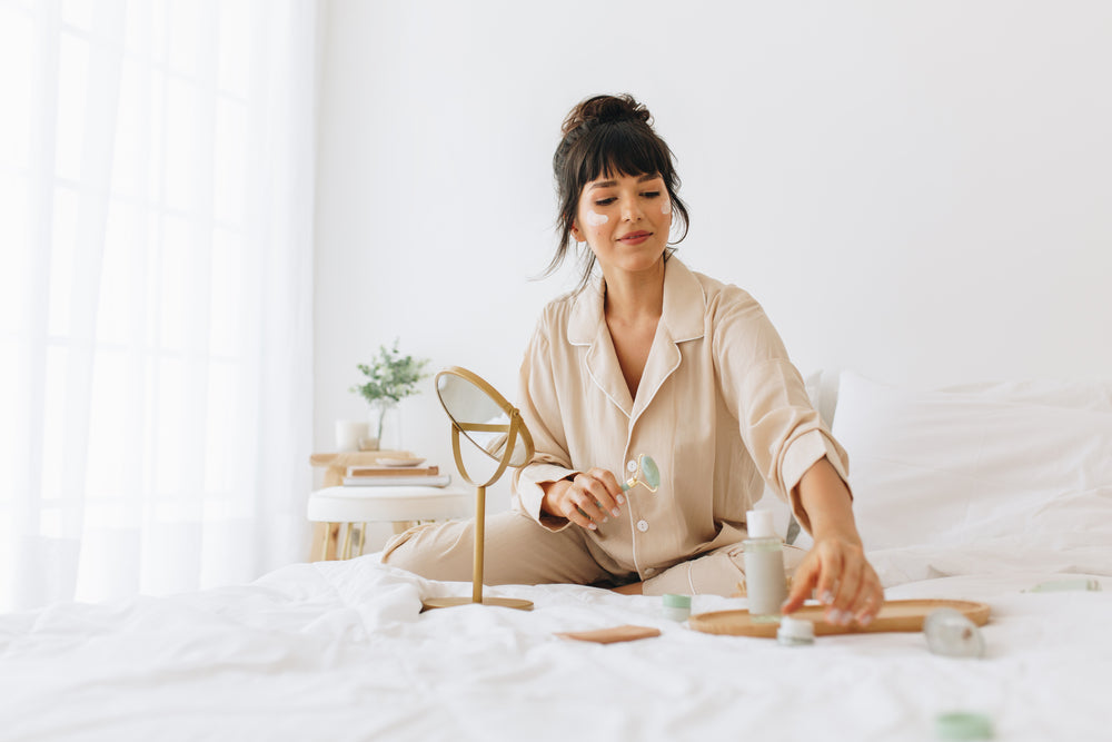 Woman using dermatologist-recommended skin care products.