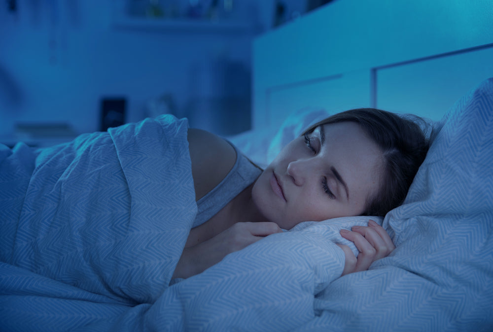 Woman sleeping peacefully on her side.