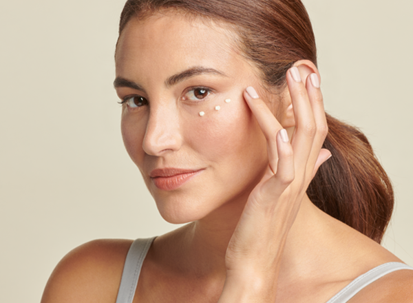 woman applying total eye FIRM & REPAIR CREAM