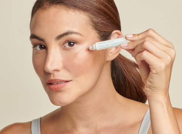 woman applying total eye CONCENTRATE