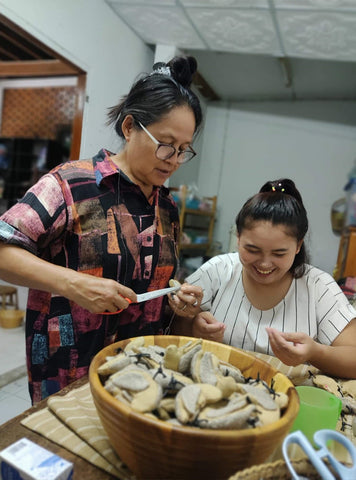 Artisans craft Charming Songbird ornaments.