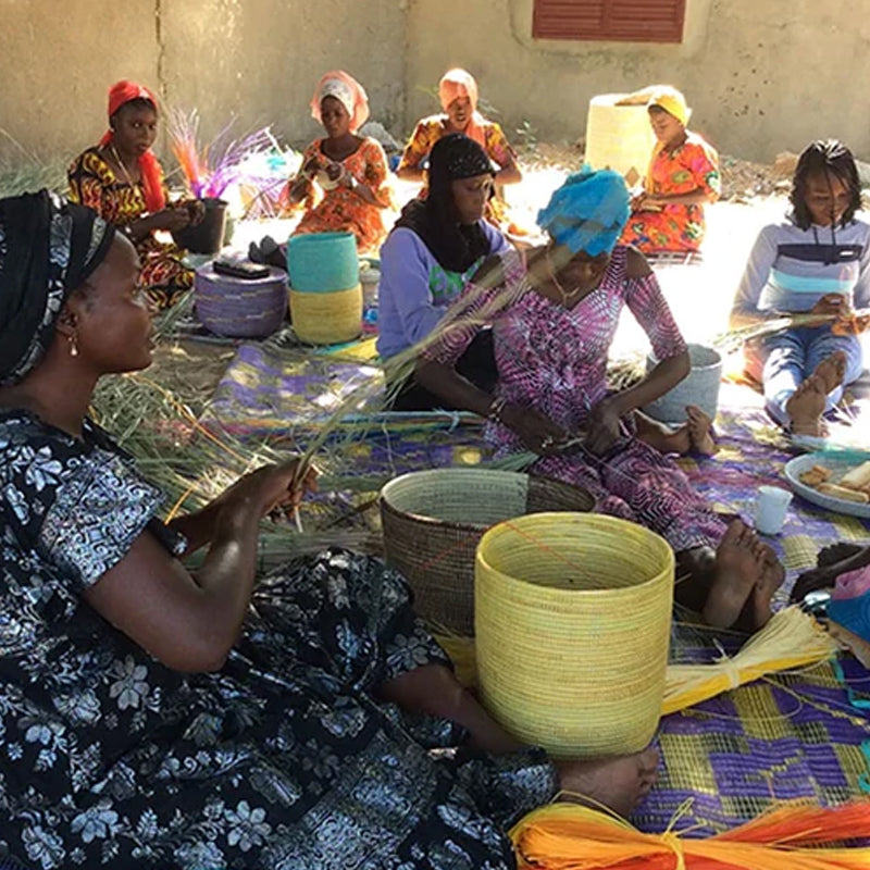 Materials used for Senegalese basket weaving: cattail stalks and colorful plastic strips