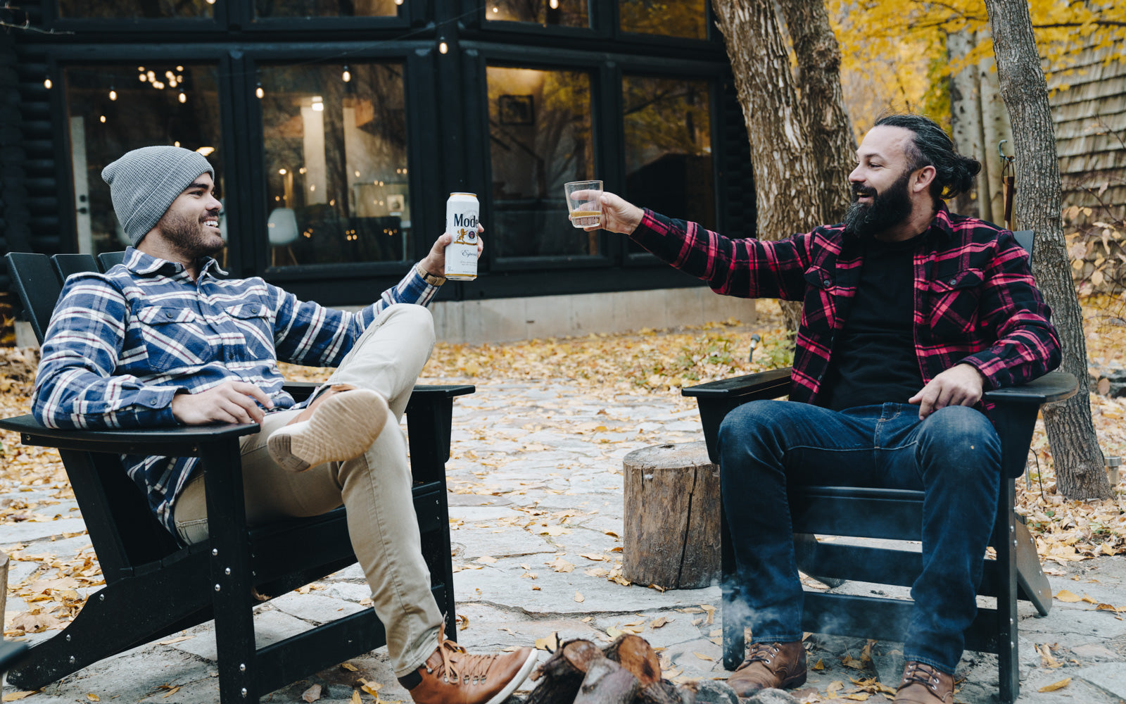 friends doing a cheers with their drinks wearing MuskOx flannels