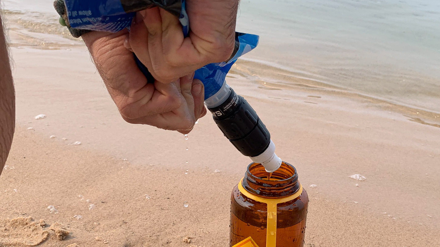 Photo of Water Filter on the Beach. MuskOx Outdoor Apparel Ultimate Guide to Beach Camping