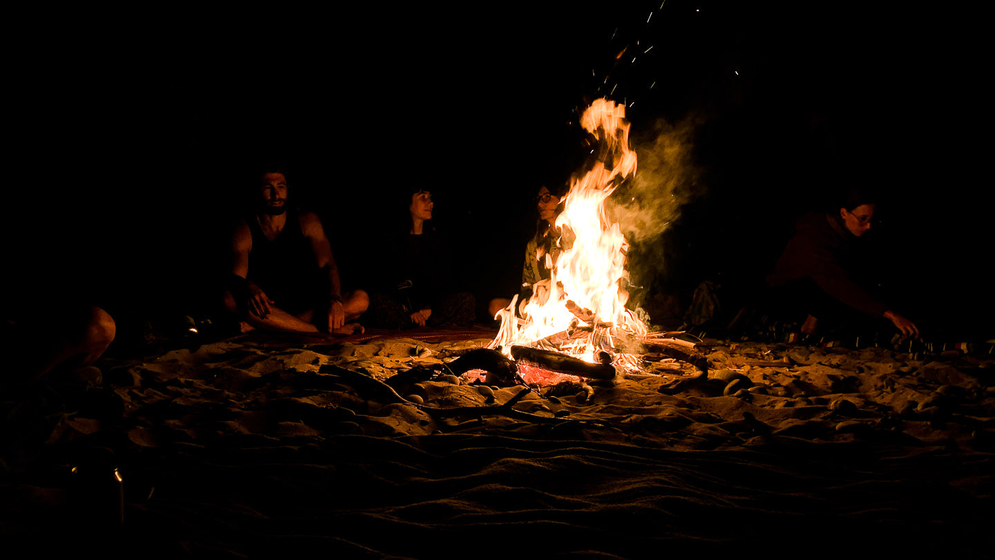 Photo of Fire at Grand Island in Michigan. MuskOx Outdoor Apparel Ultimate Beach Camping Guide.