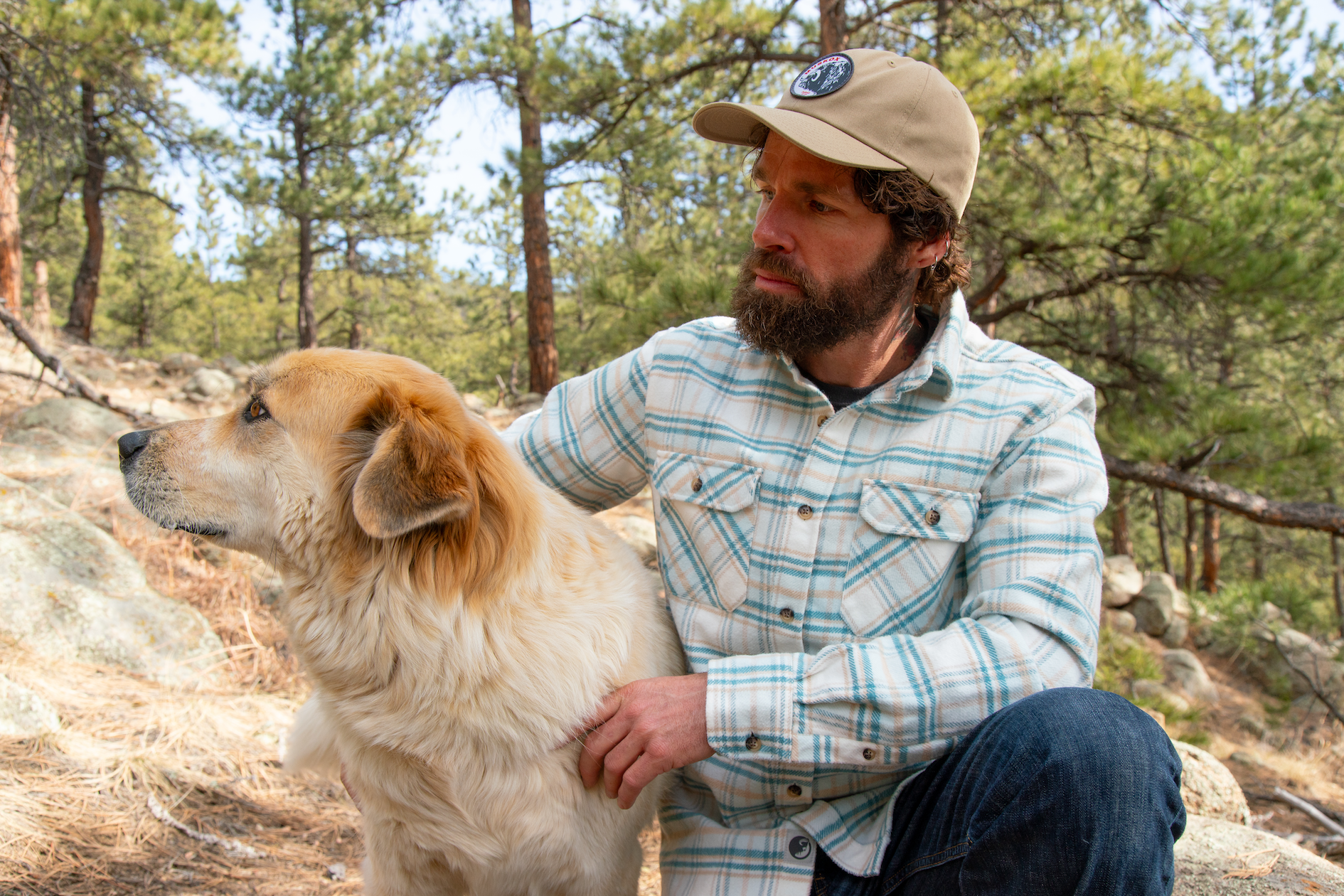 Man wearing MuskOx Coastline Flannel with his dog