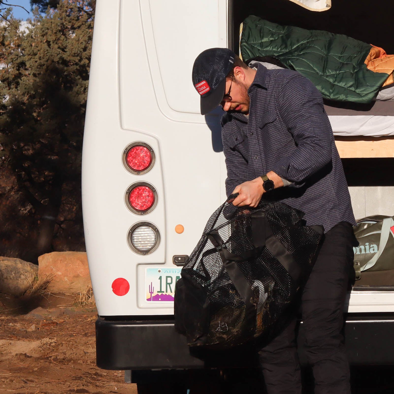 Man packing his bag wearing a MuskOx flannel