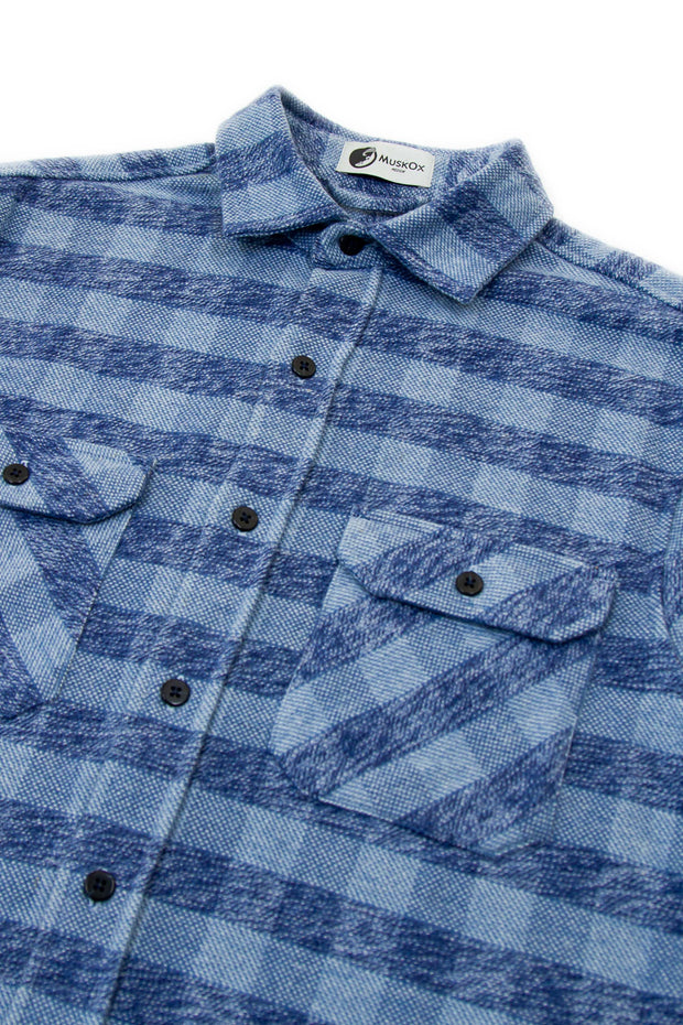The Grand Flannel in Checkered Blue By MuskOx. The Checkered Blue Grand Flannel is a Heavyweight Flannel by MuskOx Outdoor Apparel. 100% Cotton, Durable Flannel Shirt. Our flannels are made of a heavy duty cotton twill with a soft brushed finish so you can be prepared for any adventure without sacrificing comfort. Since we want you to be built for every occasion, we've included two secure chest pockets.