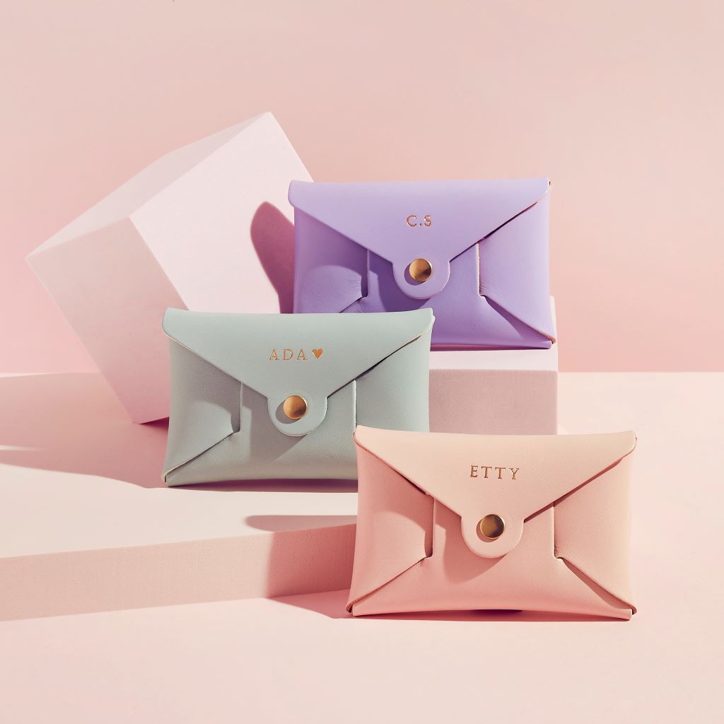 group of three pastel leather coin purses from Sbri in lilac, mint green and blush pink, personalised with initials