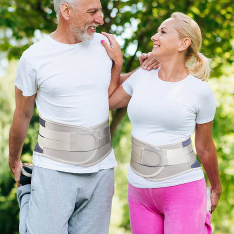 Image of an elderly couple enjoying a walk in the park while wearing the OrthoRelieve LumbarForce back brace.