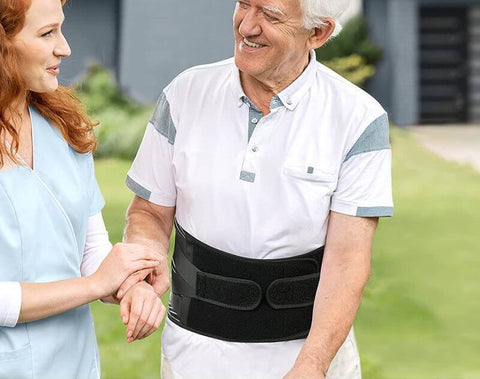 Image of elderly man undergoing rehab while wearing the OrthoRelieve LumbarPRO back brace.