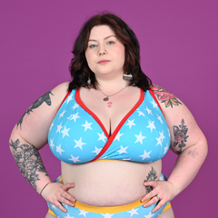 Molly is wearing a blue bra with white stars. It has red and yellow trim and band