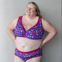 Model is wearing a purple Christmas print underwear set.