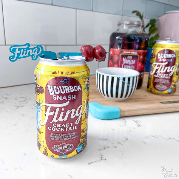 Fling canned cocktail with custom Swizzly Stick by The Pursuit of Cocktails