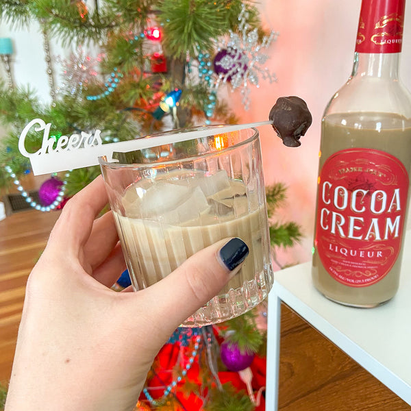 Cheers Swizzly with chocolate truffle cocktail garnish