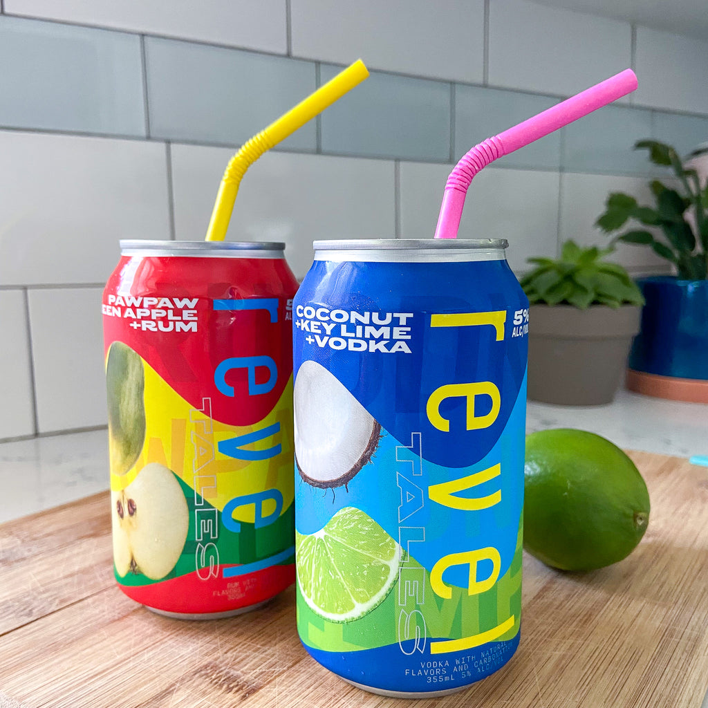 Revel Tales canned cocktails with bendy paper straws from The Pursuit of Cocktails