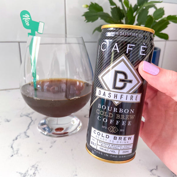 Dashfire ready-to-drink bourbon cold brew coffee cocktail styled with holiday Swizzly Stick
