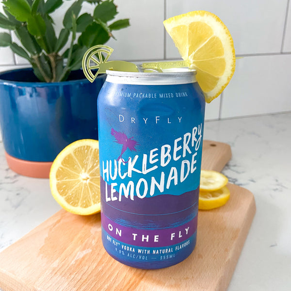 Dry Fly ready-to-drink Huckleberry Lemonade canned cocktails styled with a Swizzly Stick