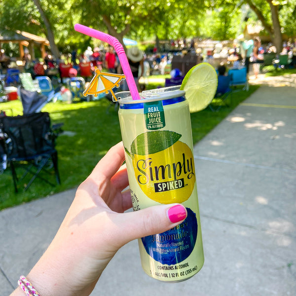 Simply Spiked Lemonade canned cocktail styled with Swizzly Stick and bendy paper straw from The Pursuit of Cocktails