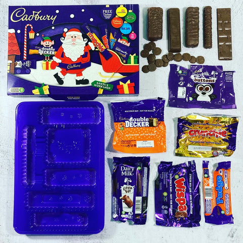 Wrapped and chocolate laid out from a cadburys selection box