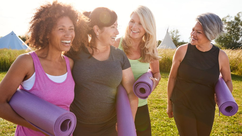 incontinence products for women lifestyle considerations blog image - 4 women with yoga mats leaving an outdoor class