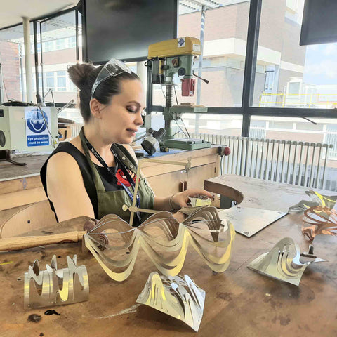 Jeweller Ellina Pollitt working at her bench