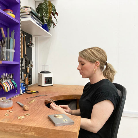 Jeweller Kali Forbes working at her bench