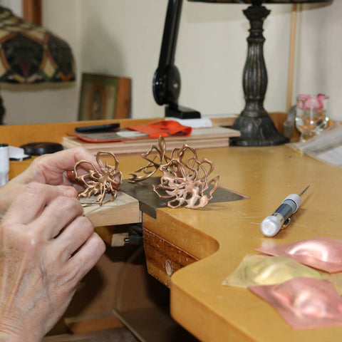 Jeweller and maker Maria Gower crafting at her bench