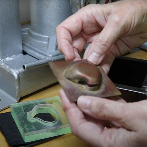Jeweller Maria Gower form pressing her pieces 