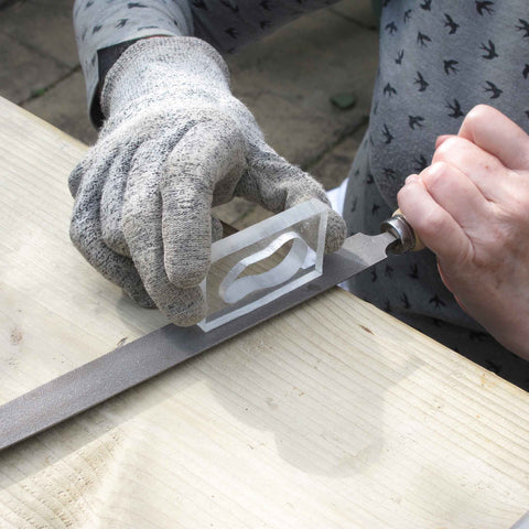 Jeweller Maria Gower filing on of her moulds