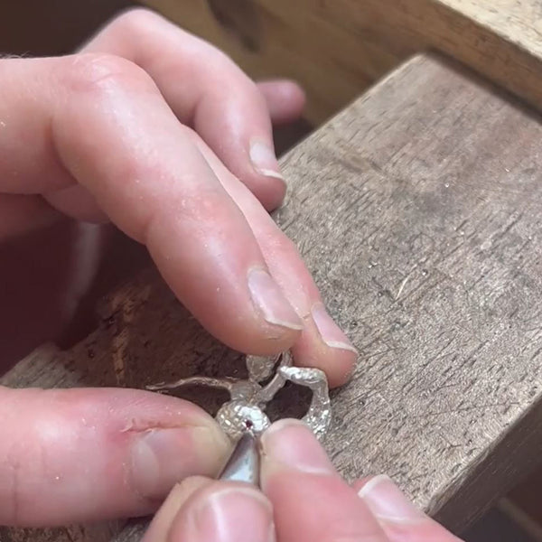 Jeweller Ruby Taglight setting a red ruby into a piece at her jewellery bench