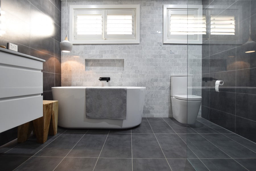 #42 - Bathrooms: Sandy's rich carrara marble blended with charcoal is