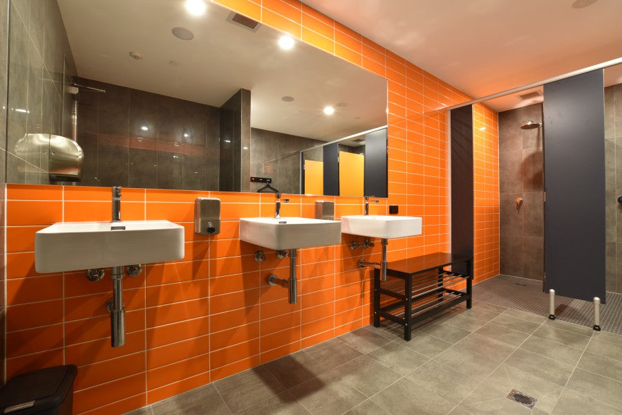 #66 - Bathrooms: Commercial bathroom with orange and black colour sche