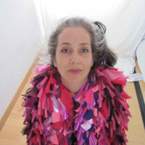 Alex Mitchell feeling good about wearing her soft multicolor lush fashion boa scarves from Twinki-Winki.