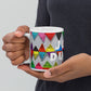 Colorful ceramic coffee mug with quirky slogan Just Ducky in white letters on Flipflop design, hands holding left view.