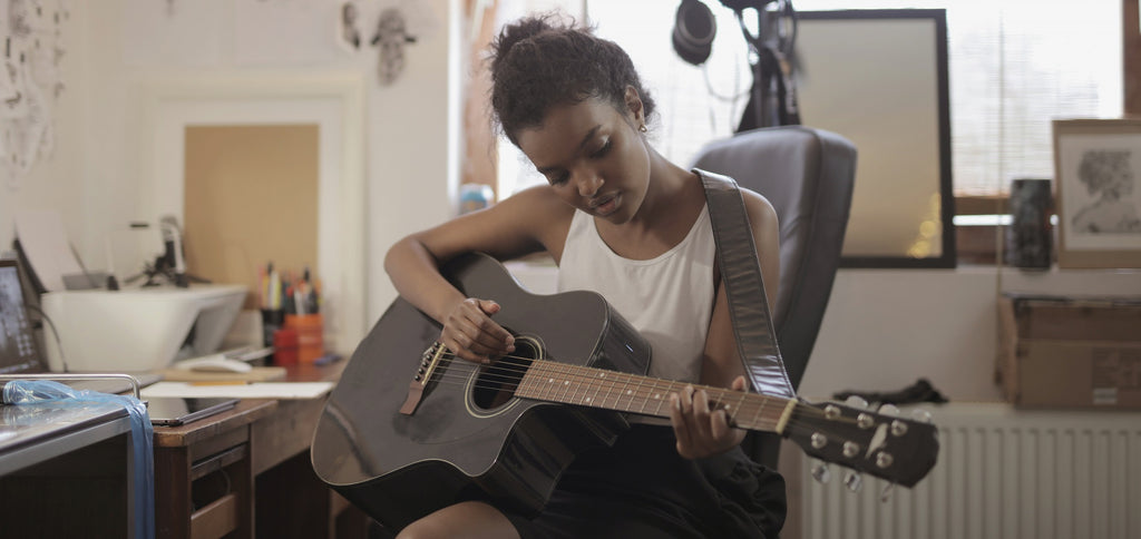 Juego de guitarra de mujer