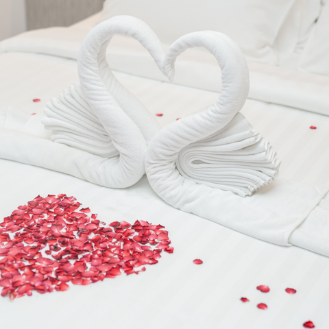 white heart shaped sheets on a bed