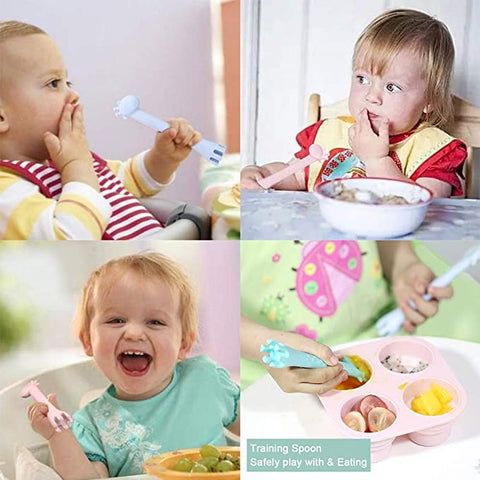 Baby eating using training spoon and fork