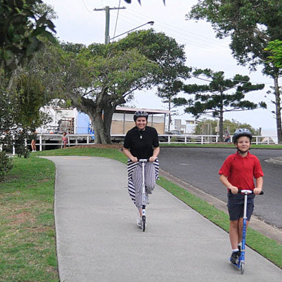 Be a Fun Mum scooting with her son