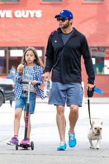 Hugh Jackman with his daughter on the Maxi Micro Scooter Hugh Jackman and family on their Micro Scooters