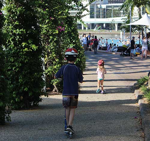 Boy scooting on his Micro Sprite on South Bank 