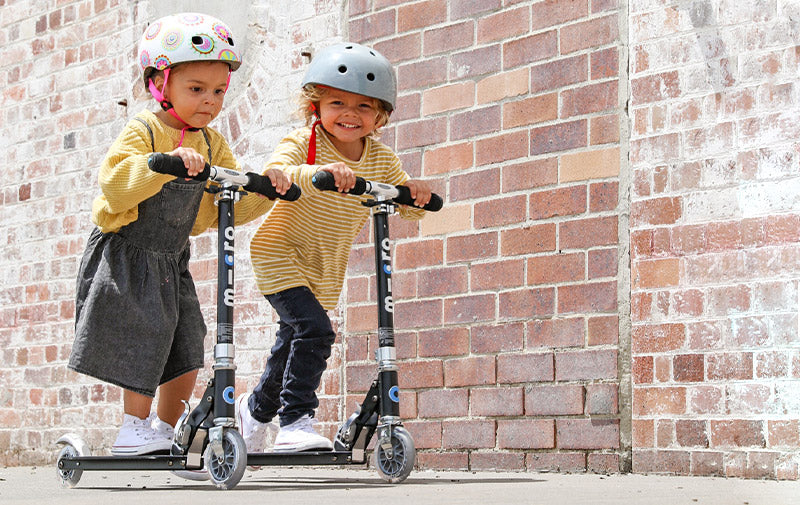 kids riding on micro sprite 2 wheel scooter