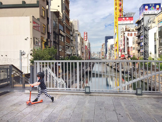 kid scooting through holiday in Japan 