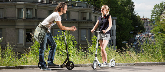 Friends scooting the school run together on Micro Scooters