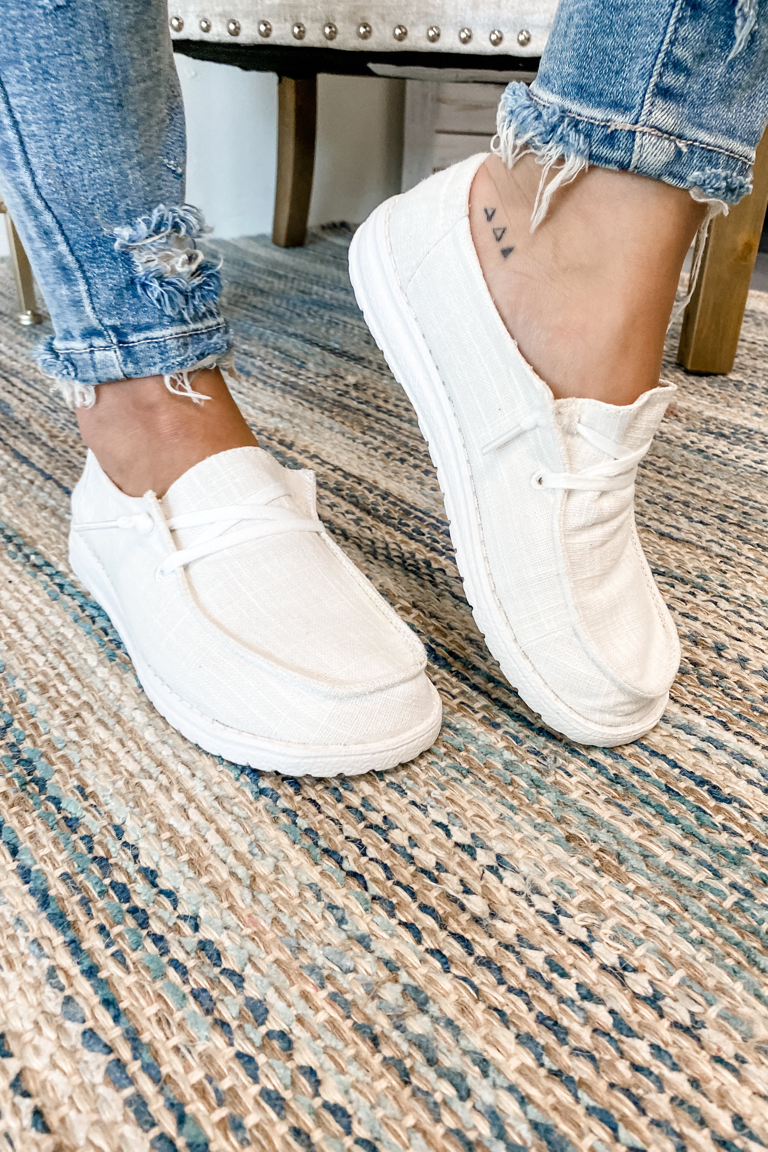 white slip on boat shoes