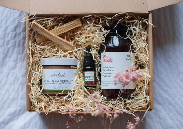 The Spring Self Care Oasis London's Bi-Monthly Self Care Box -  Self Love Box containing: Pink Grapefruit Body Polish by Wild Seed Botanicals, Hemp Superfood Face Oil by DWIRA, Renew by We+People, Palo Santo sticks